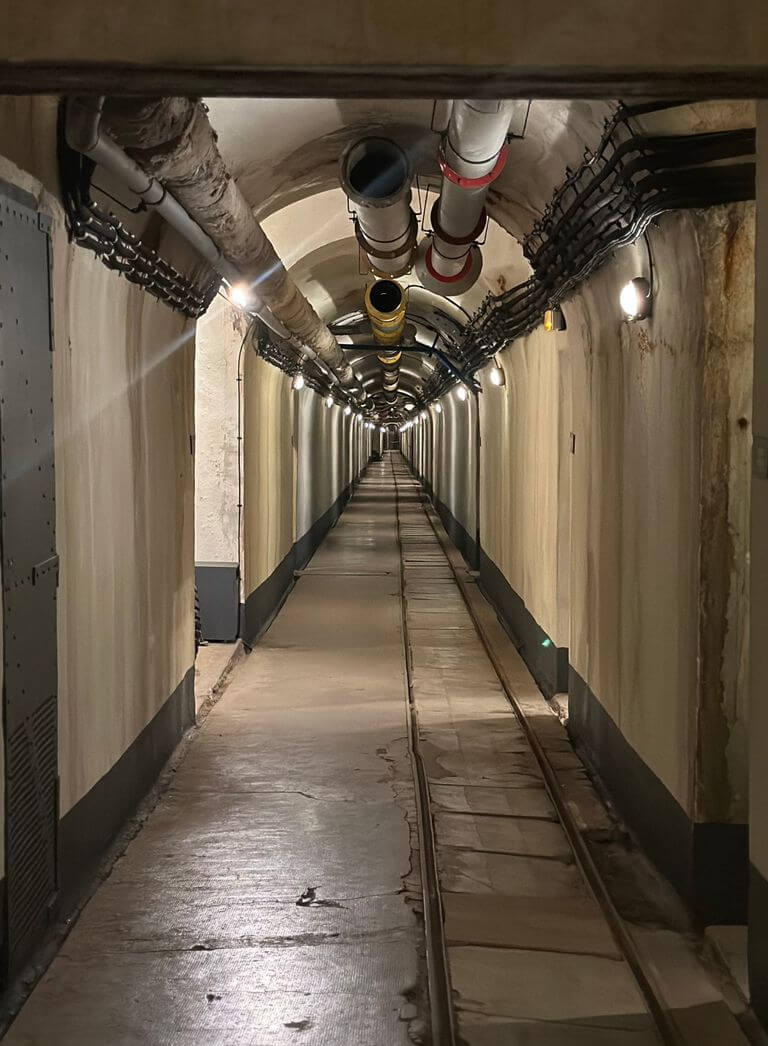 Explore a mysterious underground tunnel in Provence, France, showcasing industrial architecture and moody lighting.